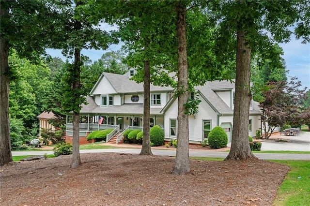 5102 Chastleton Dr, Stone Mountain, GA 30087 - view of property featuring covered porch and curved driveway