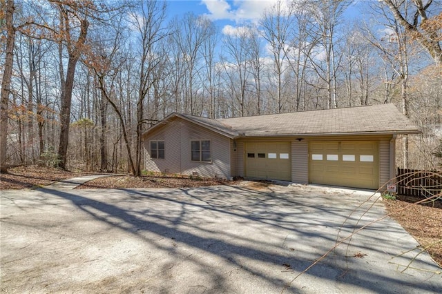 view of front of house with a garage and concrete driveway