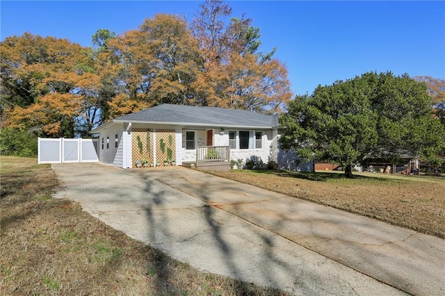 ranch-style house featuring a front lawn