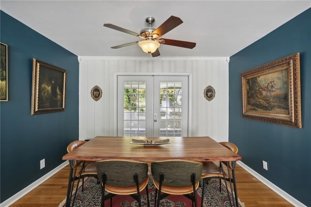 dining space with french doors, ceiling fan, and hardwood / wood-style flooring