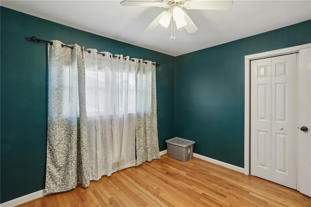 empty room featuring ceiling fan and wood-type flooring