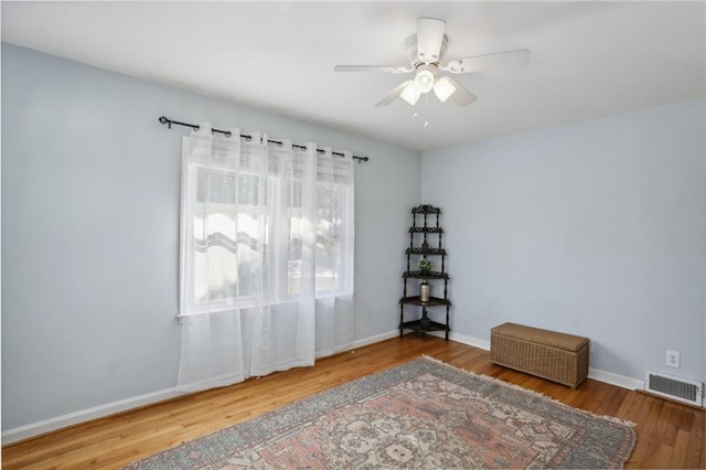 spare room with ceiling fan and hardwood / wood-style floors