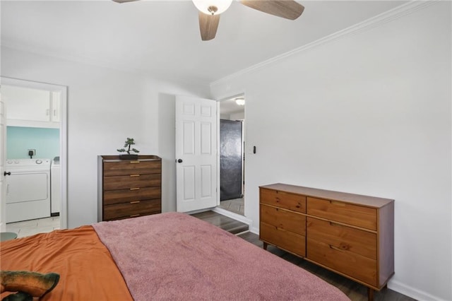 bedroom with dark hardwood / wood-style floors, ceiling fan, crown molding, and independent washer and dryer