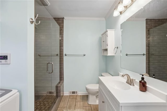 bathroom with walk in shower, crown molding, vanity, and toilet