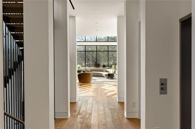 hall with light wood-style flooring