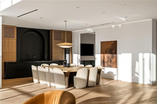 dining space with light wood-type flooring