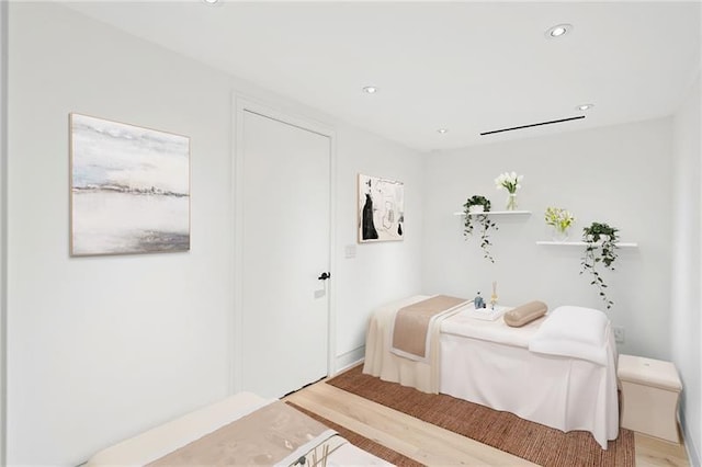 bedroom featuring recessed lighting and light wood-style floors