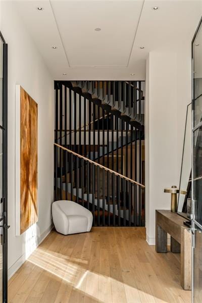 wine cellar featuring hardwood / wood-style flooring and recessed lighting