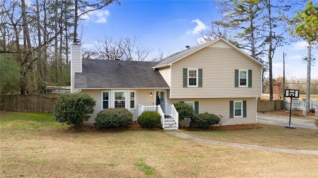 tri-level home with a front yard