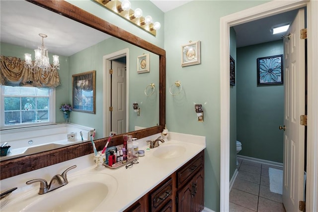 bathroom featuring toilet, a bath, a chandelier, tile patterned floors, and vanity