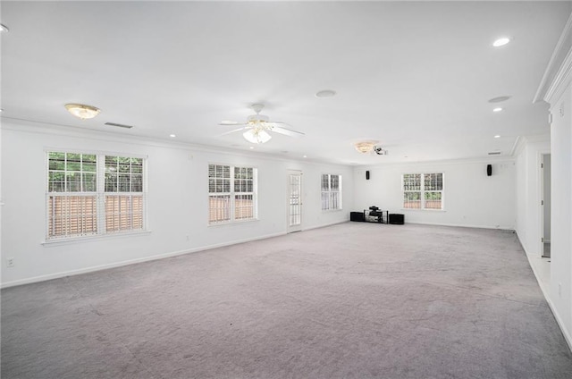 2949 Maple Walk Ct, Lawrenceville, GA 30044 - unfurnished living room featuring a healthy amount of sunlight, crown molding, light carpet, and ceiling fan
