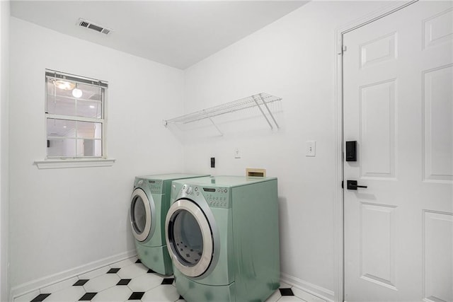2949 Maple Walk Ct, Lawrenceville, GA 30044 - clothes washing area with light tile patterned flooring and washer and dryer