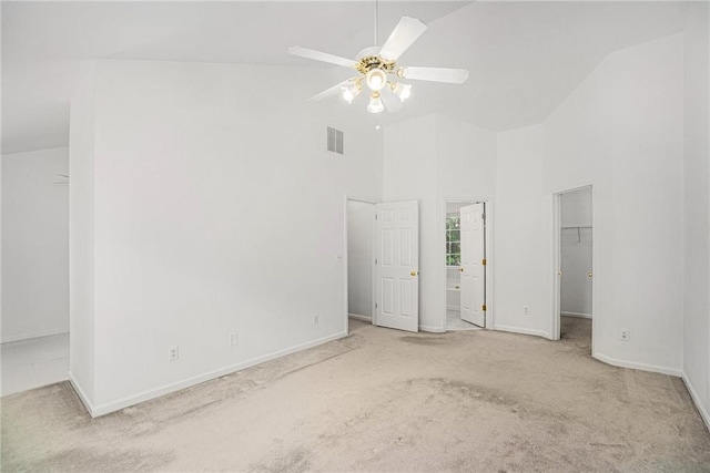 2949 Maple Walk Ct, Lawrenceville, GA 30044 - unfurnished bedroom with connected bathroom, a walk in closet, high vaulted ceiling, light carpet, and ceiling fan