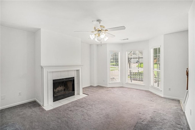 2949 Maple Walk Ct, Lawrenceville, GA 30044 - unfurnished living room featuring a tiled fireplace, light colored carpet, and ceiling fan