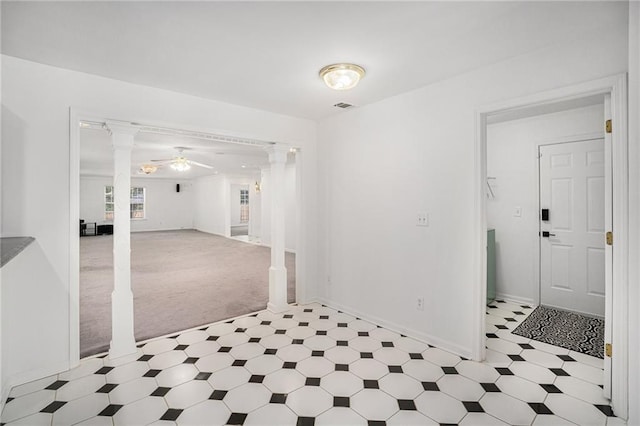 2949 Maple Walk Ct, Lawrenceville, GA 30044 - empty room with decorative columns, ceiling fan, and light tile patterned floors