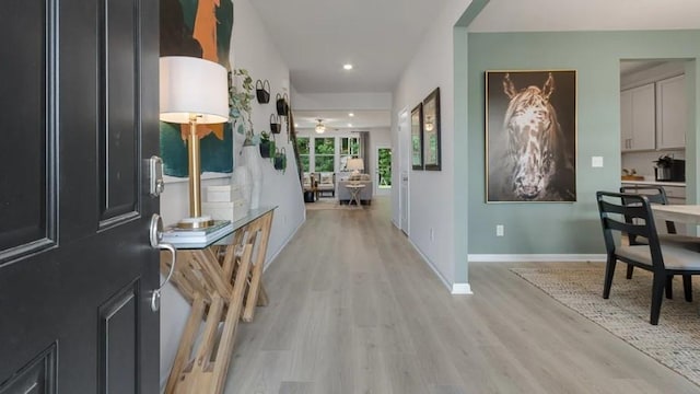 corridor featuring light hardwood / wood-style floors