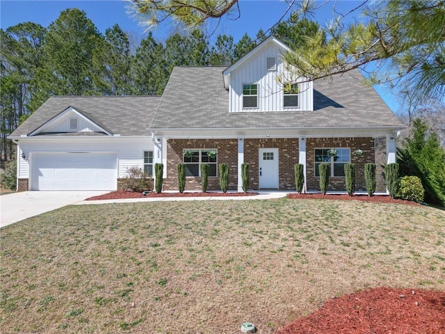 view of front of property featuring a garage, brick siding, and a front lawn