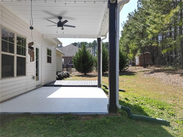 view of patio / terrace featuring a ceiling fan and fence