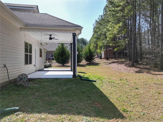 view of yard featuring a ceiling fan