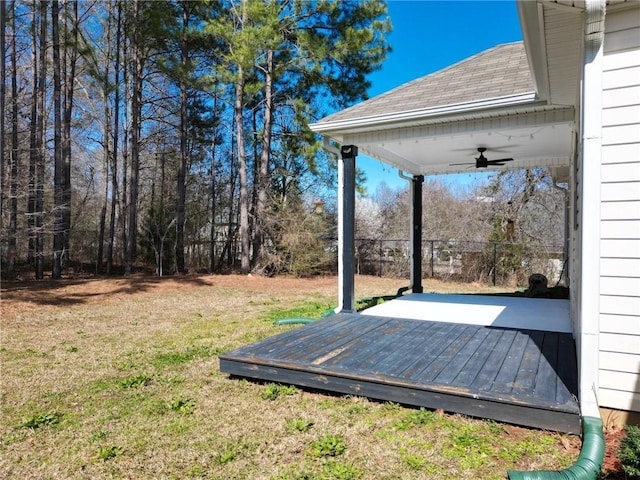 view of yard featuring a ceiling fan and a wooden deck