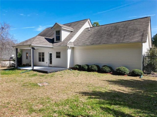 back of property featuring a yard, a patio, and fence