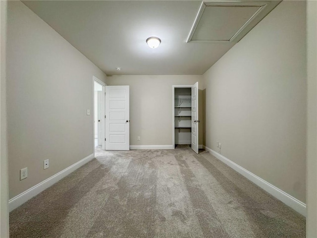 empty room featuring baseboards and carpet floors