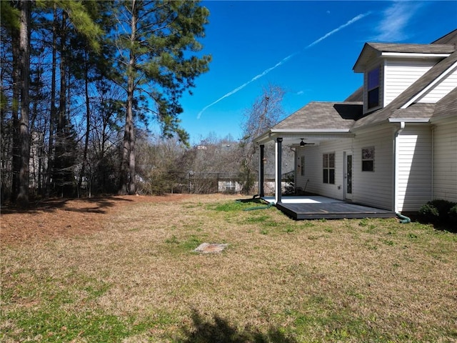 view of yard featuring a ceiling fan