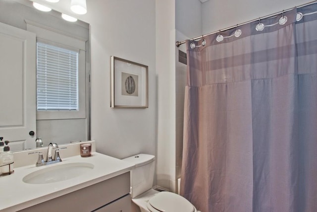 bathroom featuring oversized vanity and toilet