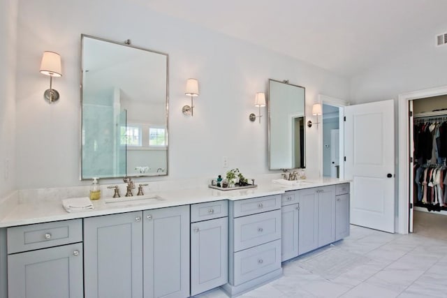 bathroom featuring dual vanity and tile floors