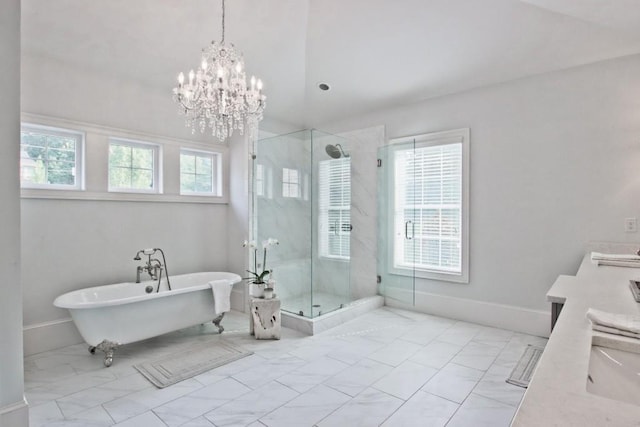 bathroom featuring an inviting chandelier, tile flooring, and plenty of natural light