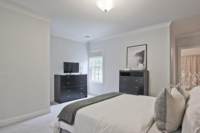 bedroom featuring crown molding and light carpet