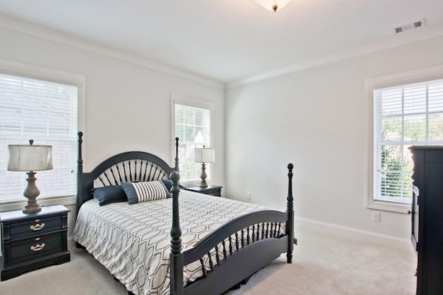 carpeted bedroom featuring crown molding