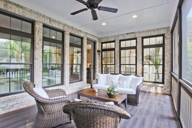 sunroom / solarium featuring ceiling fan and a healthy amount of sunlight