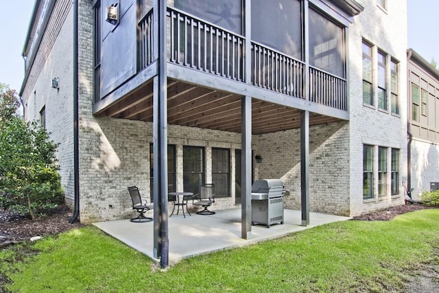 exterior space with a balcony and grilling area