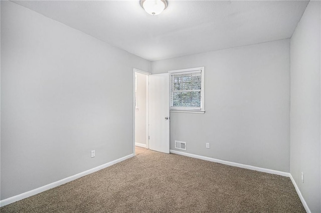 spare room featuring carpet floors