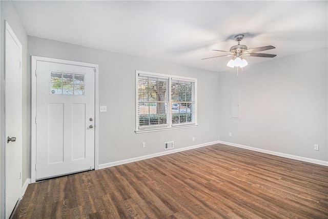 foyer entrance with plenty of natural light, dark wood-type flooring, and ceiling fan