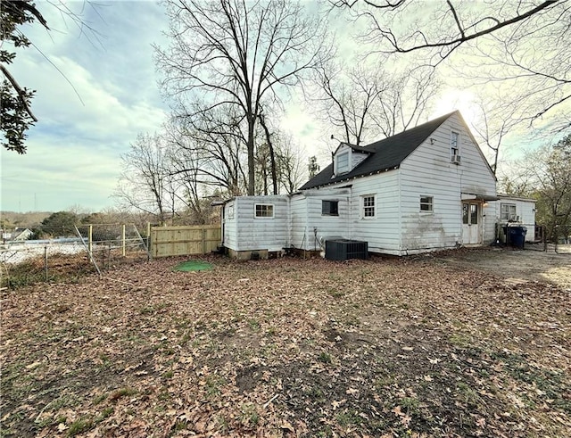 back of house featuring central air condition unit