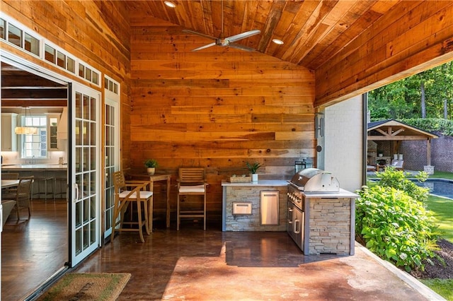view of patio with area for grilling, french doors, and grilling area