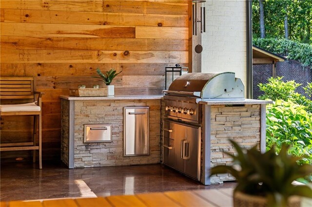 view of patio with exterior kitchen and area for grilling
