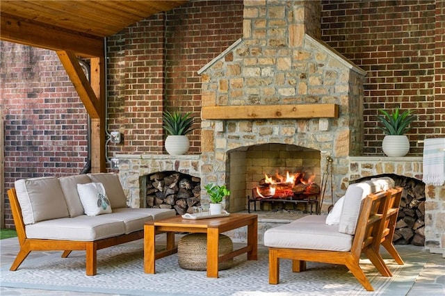 view of patio / terrace featuring an outdoor living space with a fireplace