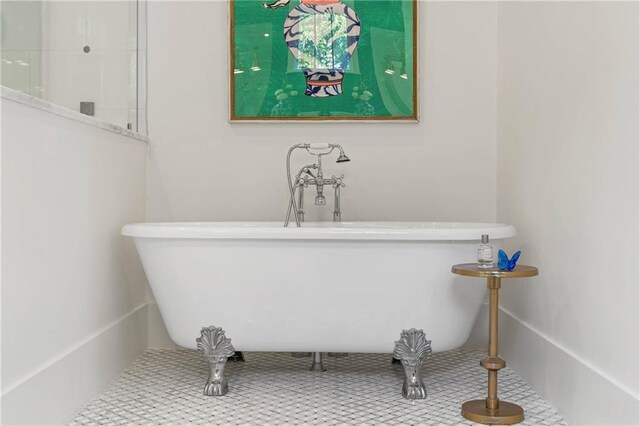 full bathroom with a freestanding bath