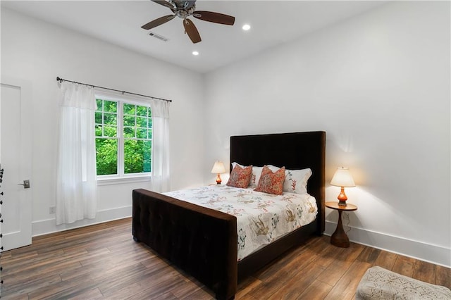 bedroom featuring wood finished floors, baseboards, recessed lighting, and a ceiling fan
