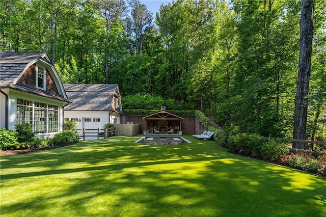 view of yard featuring a gazebo and a garage