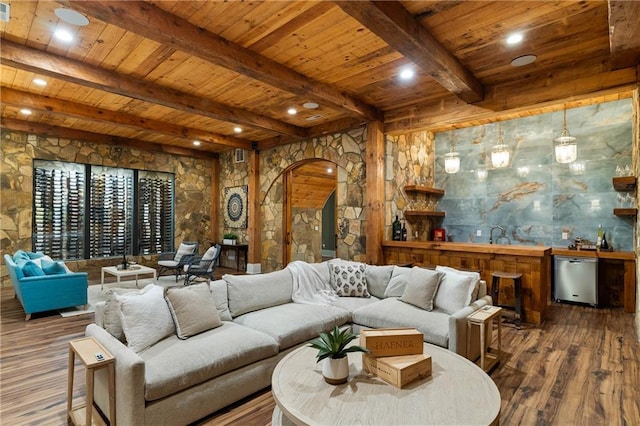living area with wooden ceiling, arched walkways, wood-type flooring, beamed ceiling, and recessed lighting