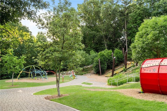 view of property's community featuring a lawn and view of scattered trees