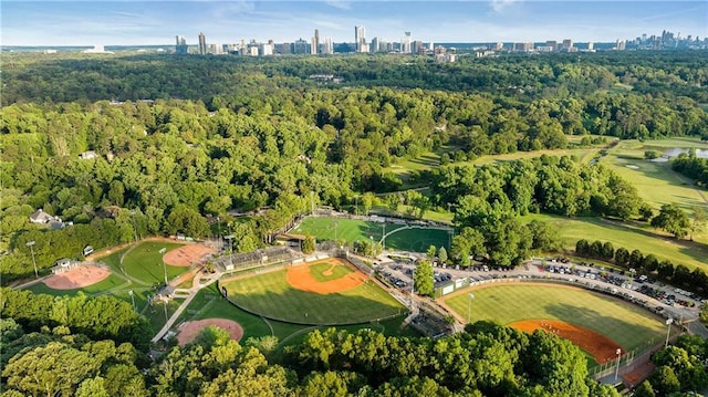 aerial overview of property's location featuring a view of skyline and a heavily wooded area