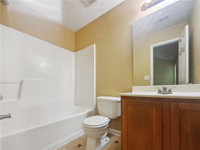 full bathroom with toilet, vanity, tile patterned floors, and washtub / shower combination