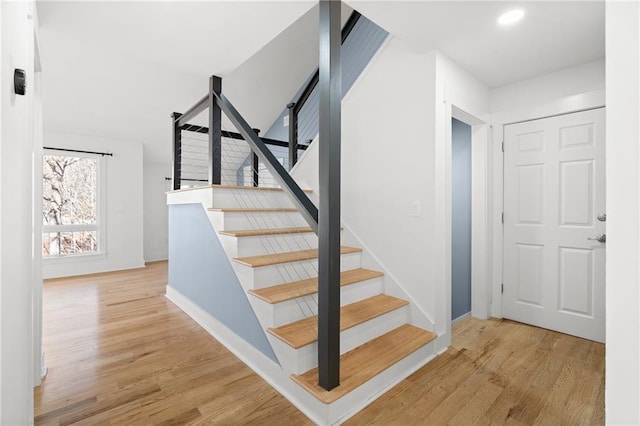 staircase featuring hardwood / wood-style flooring