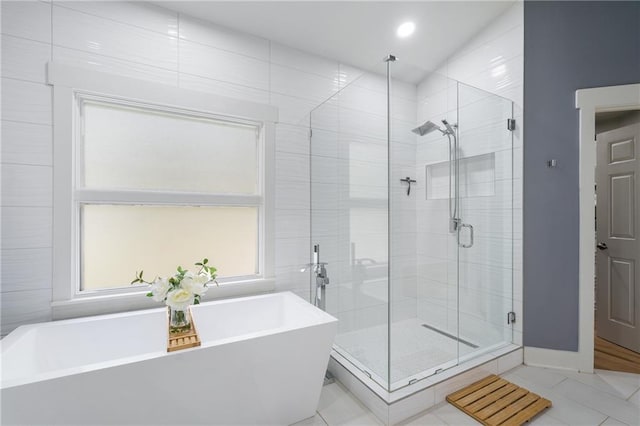 bathroom featuring tile patterned floors and plus walk in shower