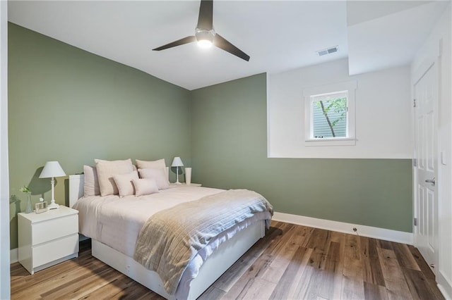 bedroom featuring ceiling fan and wood-type flooring